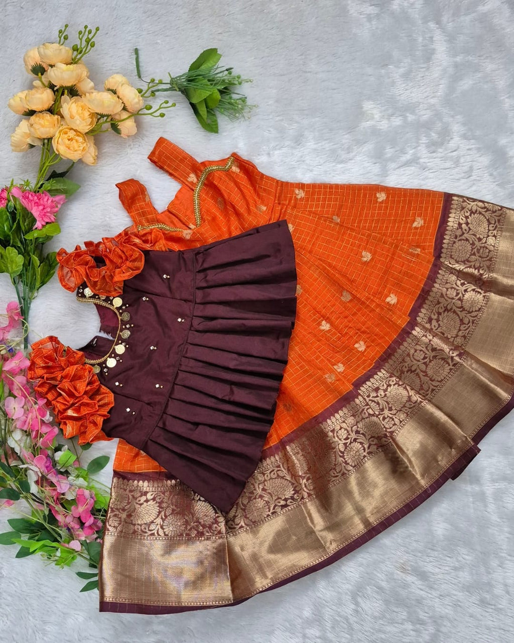 A rich and vibrant Maroon &amp; Orange with Gold zari border combination