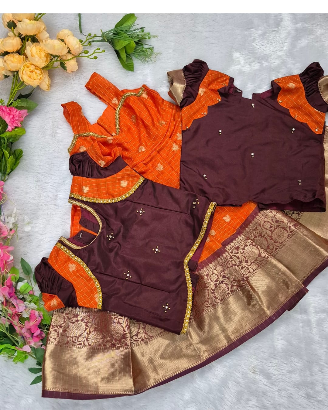 A rich and vibrant Maroon &amp; Orange with Gold zari border combination