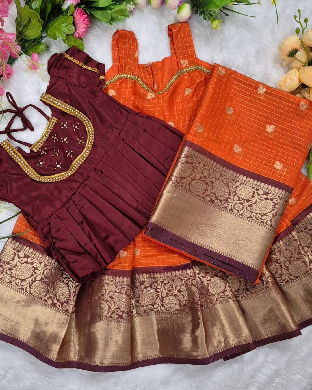A rich and vibrant Maroon &amp; Orange with Gold zari border combination