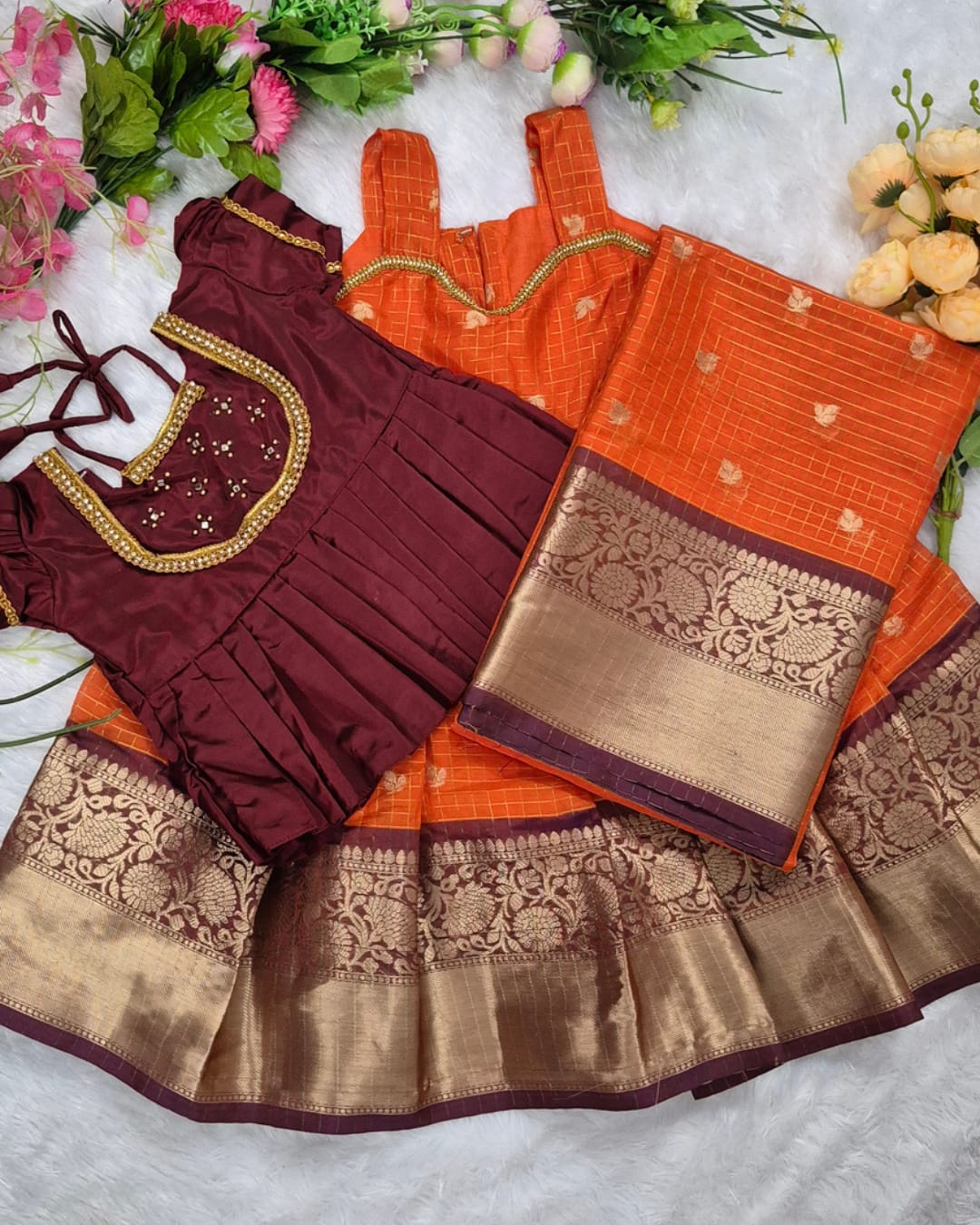 A rich and vibrant Maroon &amp; Orange with Gold zari border combination