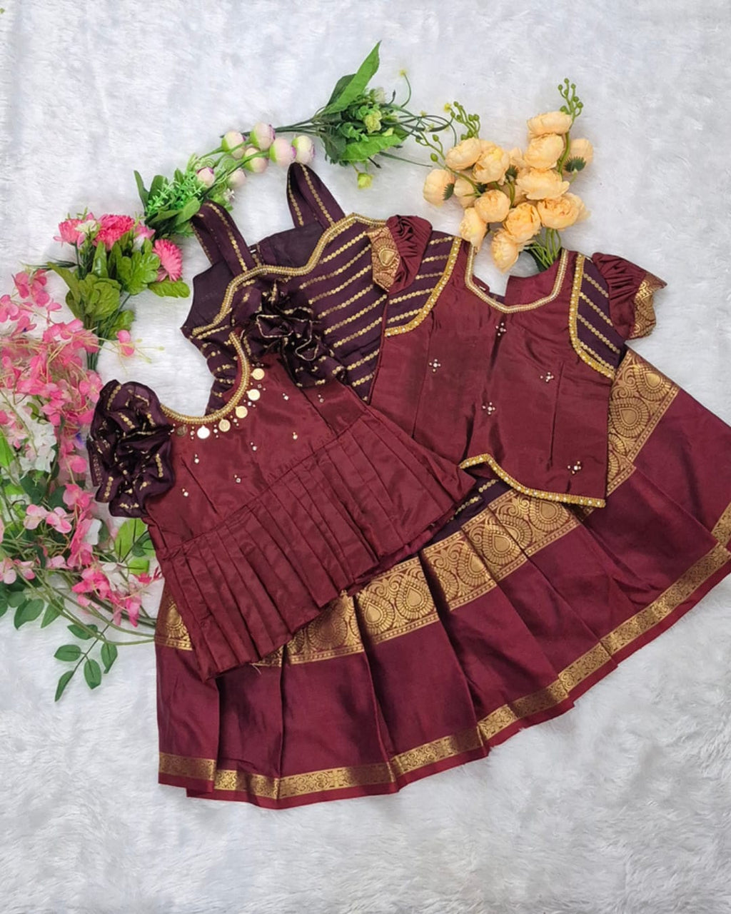 A rich and elegant Maroon with Gold zari border combination