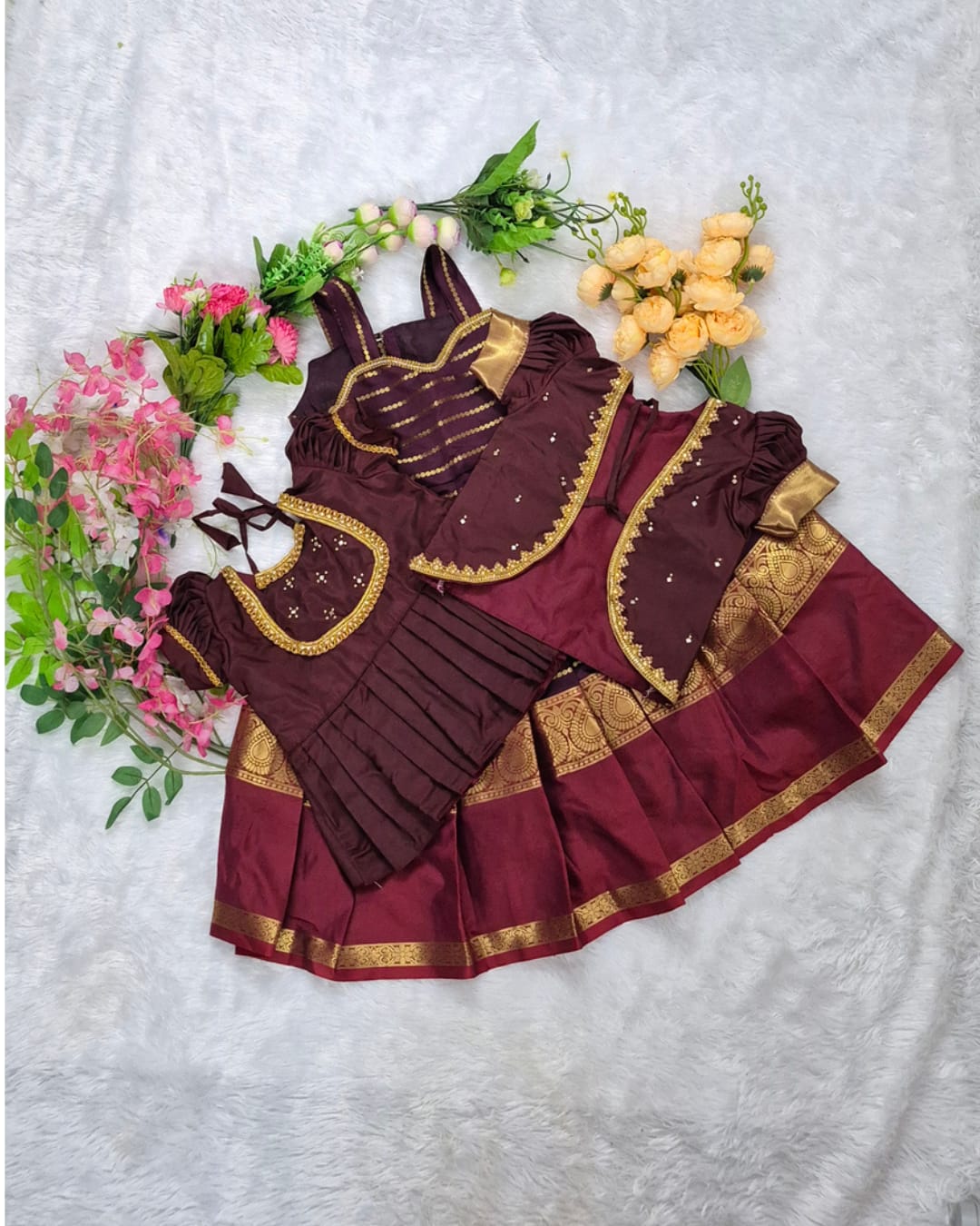 A rich and elegant Maroon with Gold zari border combination