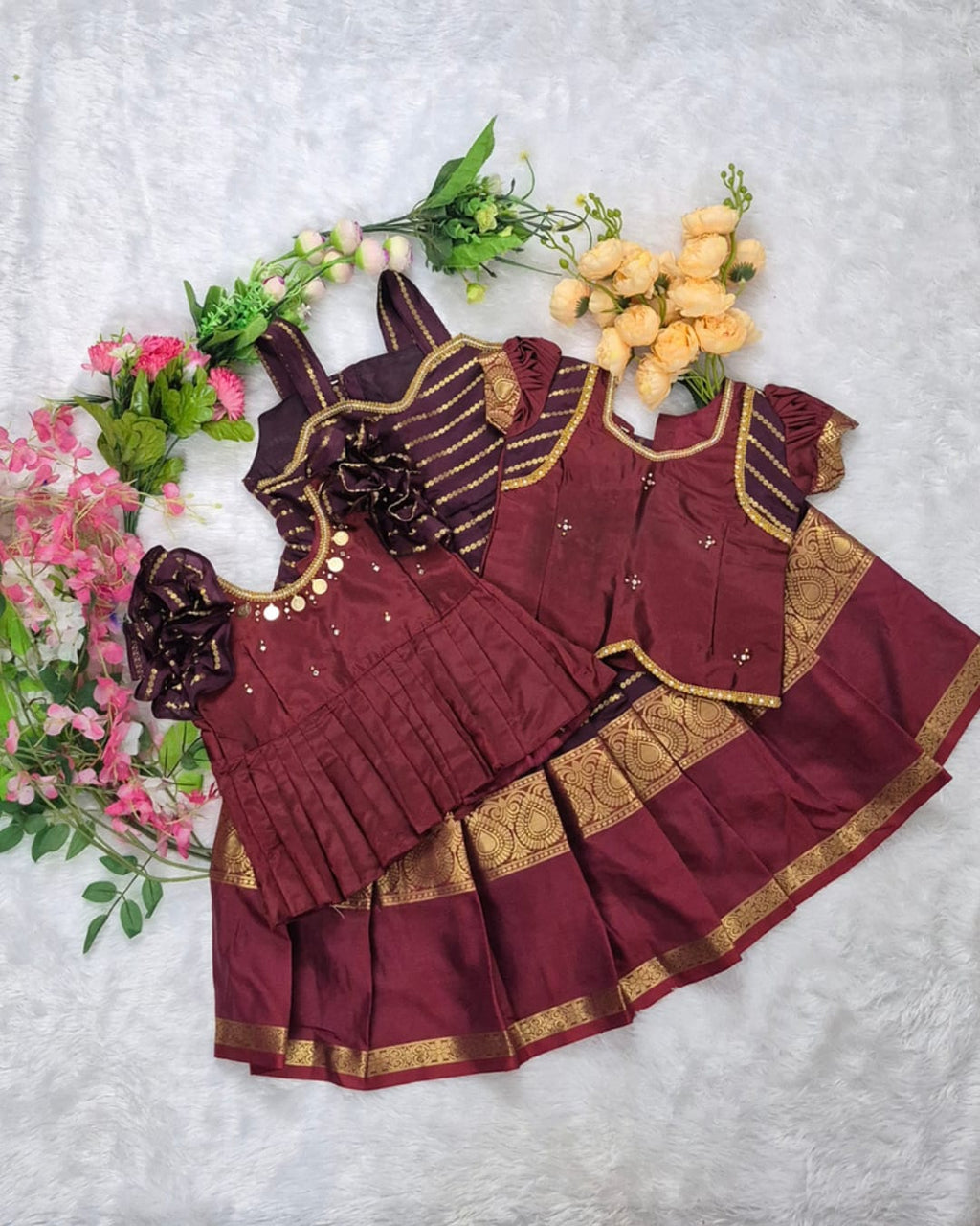 A rich and elegant Maroon with Gold zari border combination