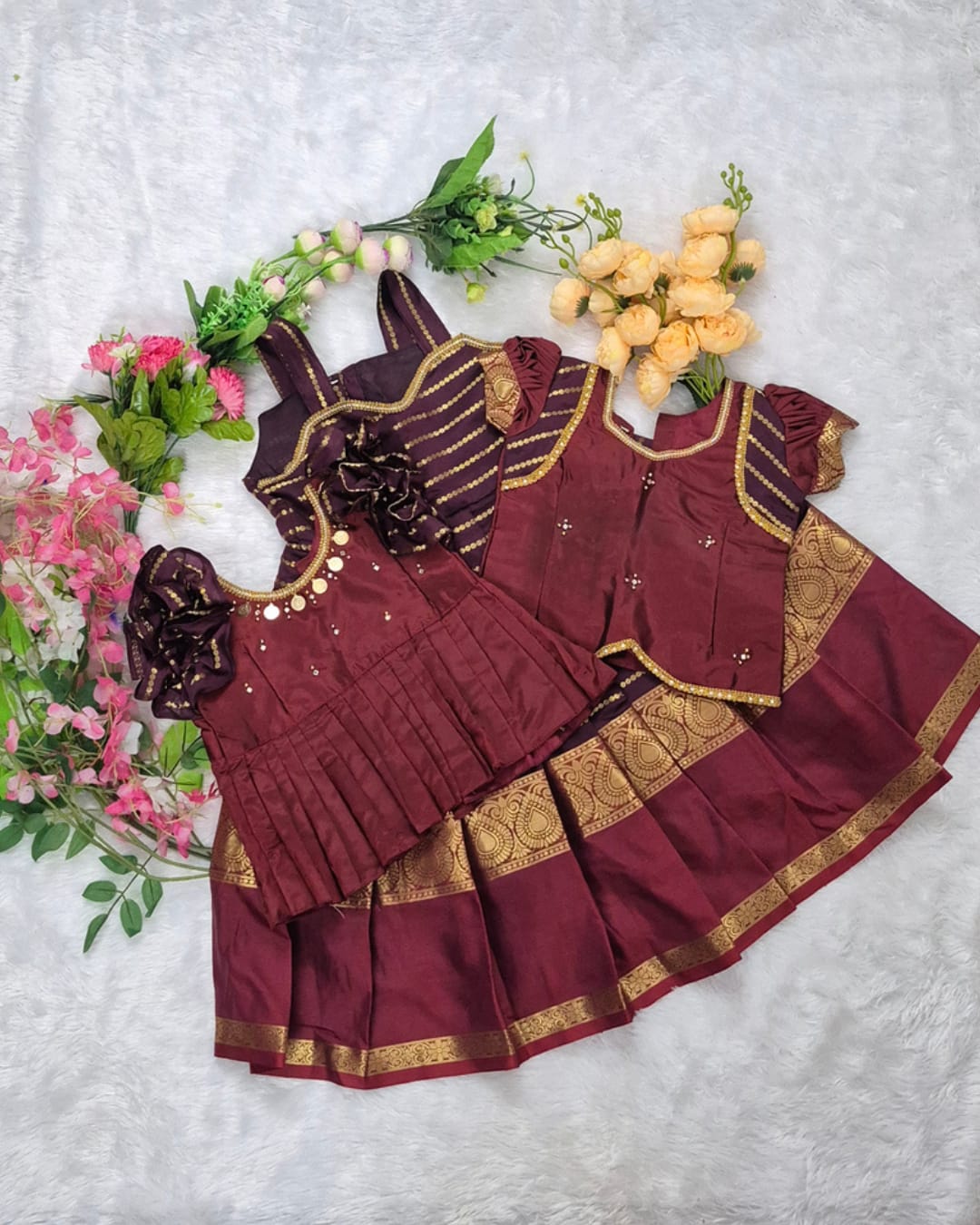 A rich and elegant Maroon with Gold zari border combination