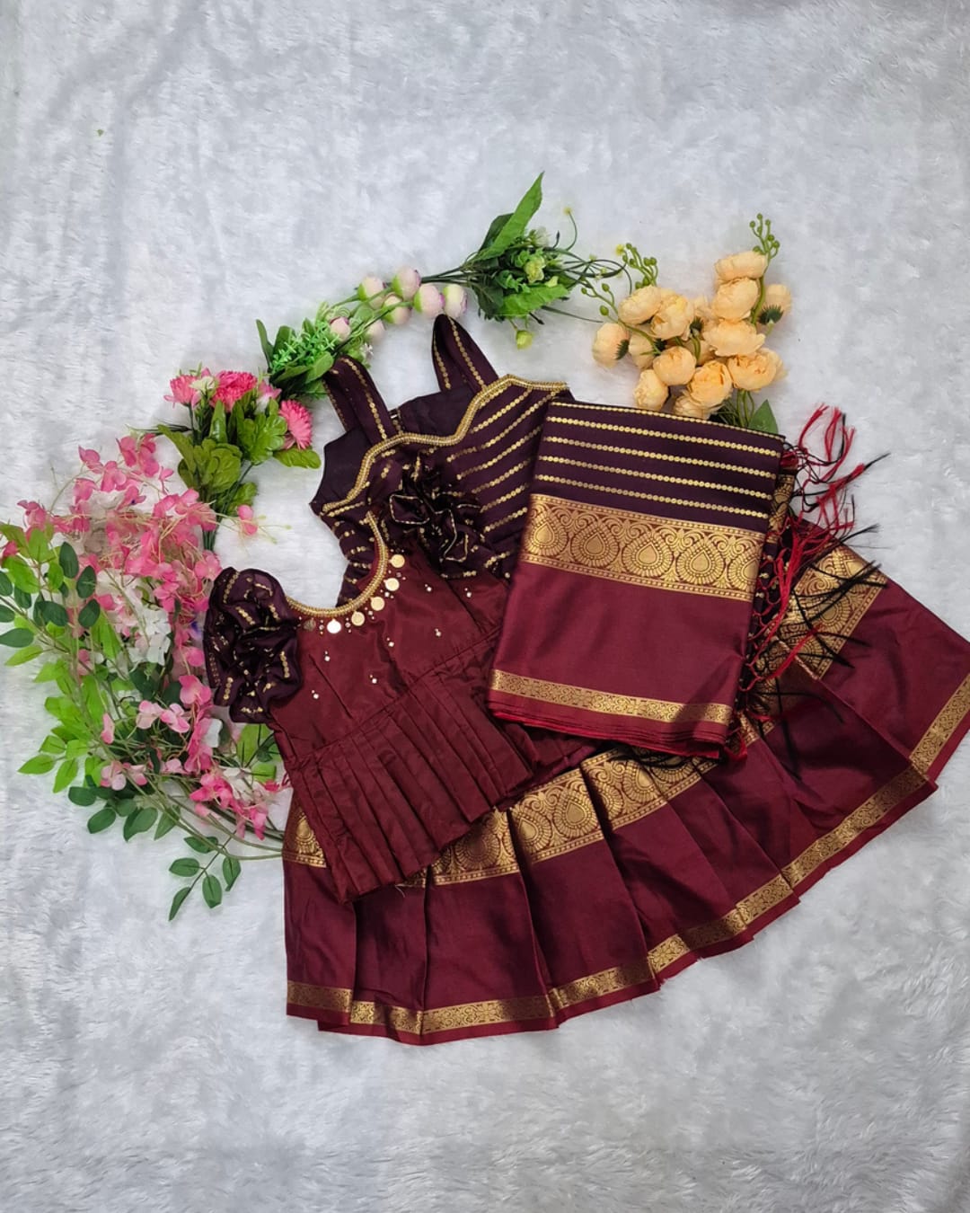 A rich and elegant Maroon with Gold zari border combination